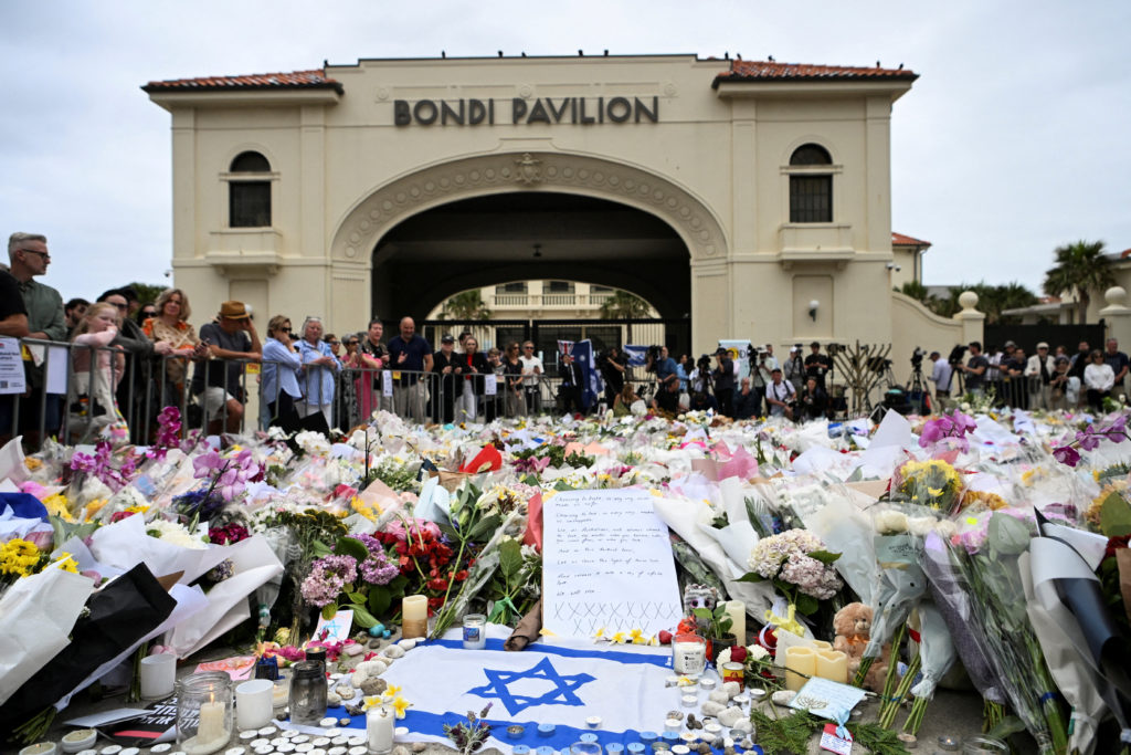 People Mourning the victims of hanukkah shooting after the attack