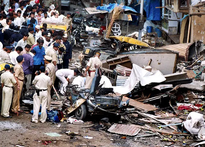 Emergency services respond to the serial bombings across Bombay