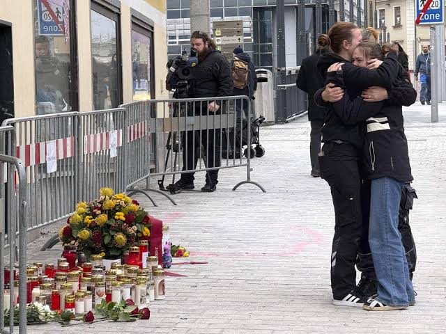 People grieving the loss of the dead in the mass stabbing